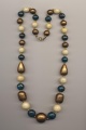 Necklace made of plastic beads imitating ivory, turquoise and bronze, China, 1980's, length 26'' 65cm.